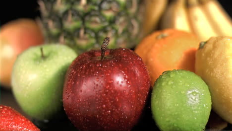 drop falling on apple in super slow motion