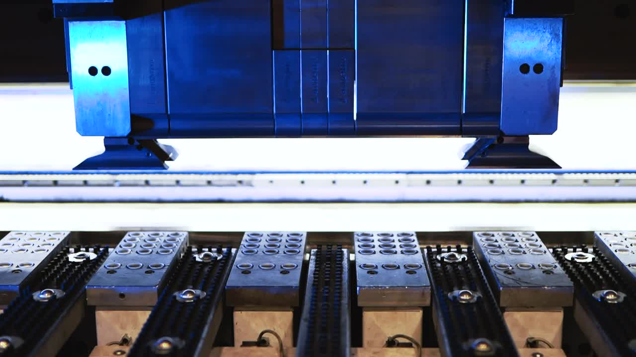 Automatic machine processing sheet metal in high tech workshop