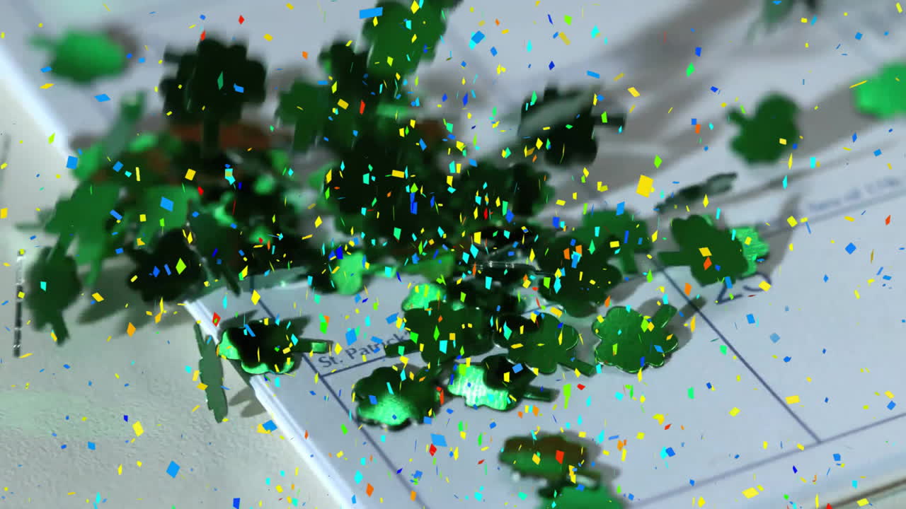 Shamrocks and confetti animation over calendar marked for saint patrick's day