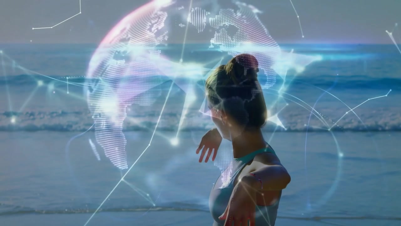 Žena se protahuje na okraji oceánu, iniciuje digitální tvary splývající s rotující koulí pro fitness technologii