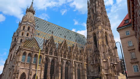 vienna, austria - june 9, 2025: visit st. stephen's cathedral. tourists admire the stunning architecture of st. stephen's cathedral in vienna under a clear blue sky