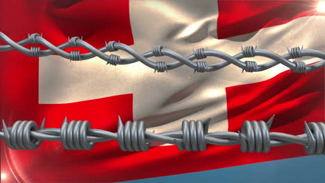 Stacheldraht-Gegen-Wehende-Schweizer-Flagge