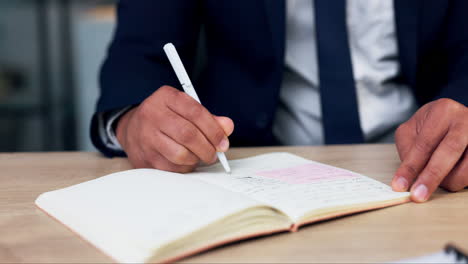 hand, writing and notebook for man at desk