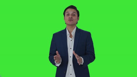 Happy-Indian-journalist-reading-news-Green-screen