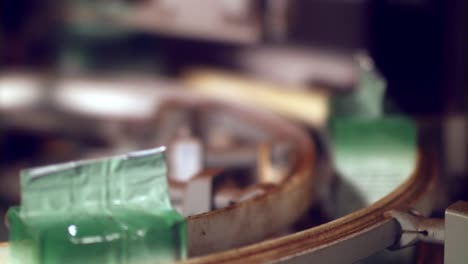 packaging instant coffee at a factory with the bundles of product on the conveyer belt