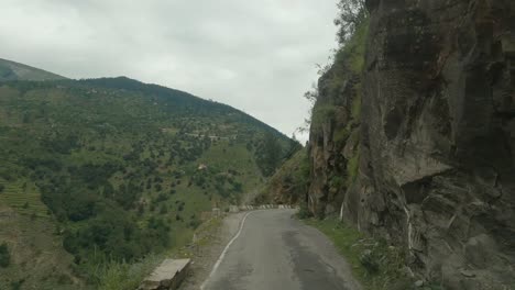 a timelapse of a vehicle passing through the most dangerous and narrow cliff-carved roads through indian himalayas in kinnaur district on way to sangla and chitkul valley