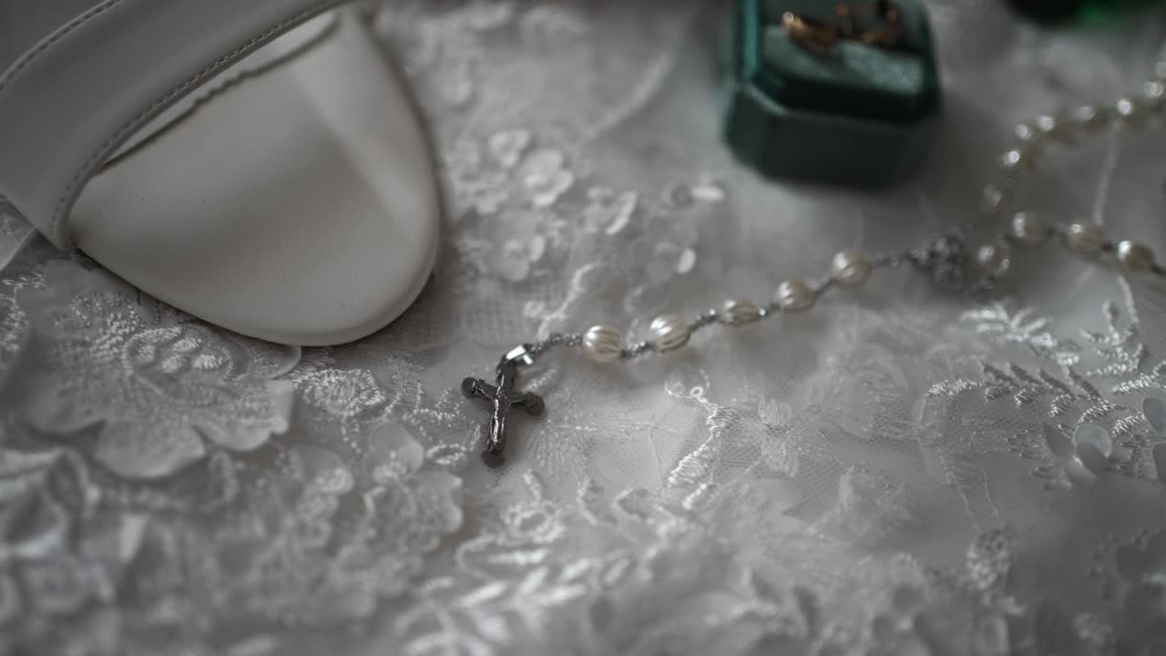 Elegant white shoe and rosary on lace, evoking purity, faith, and love