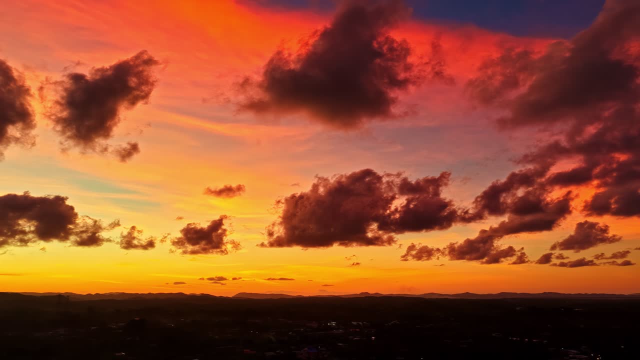 A Vibrant Sunset Lights Up the Sky and Sea in Poblacion V Purok V, General Luna, Siargao Island, Philippines - Aerial Drone Shot