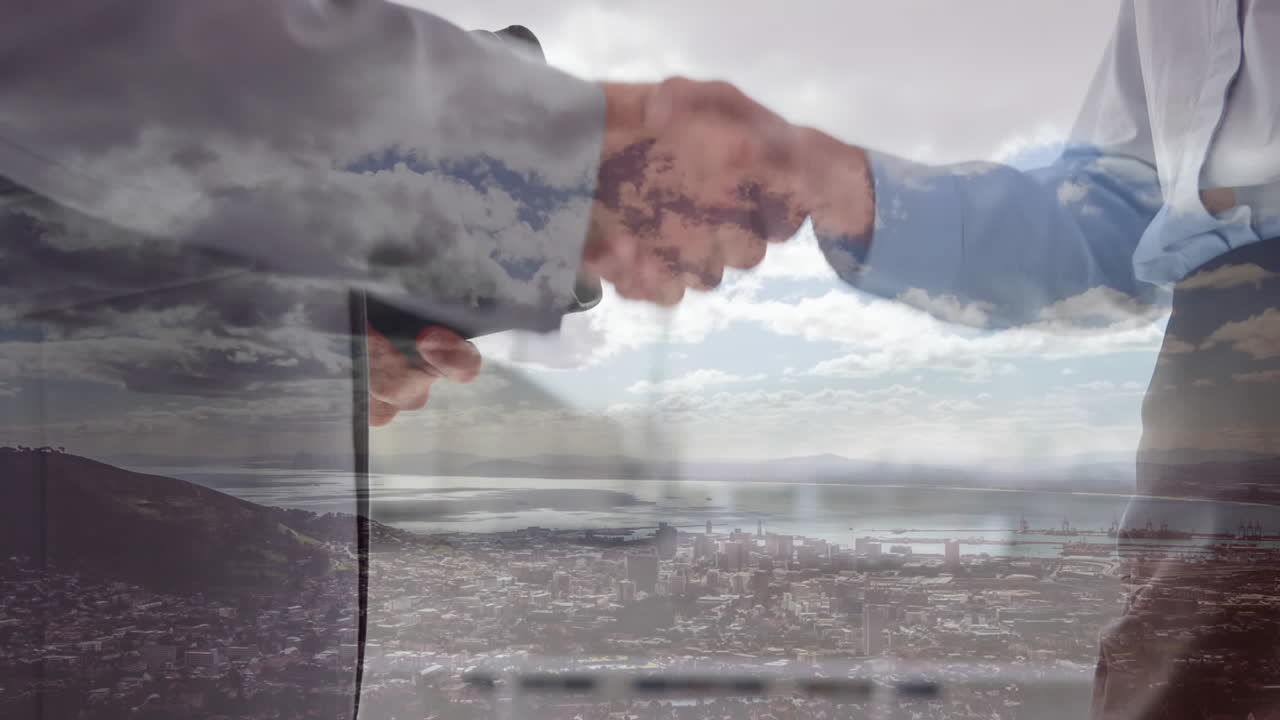 apretón de manos con la ciudad en el fondo