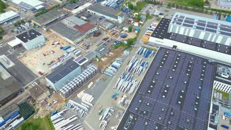 aerial view of modern storage warehouse with solar panels on the roof