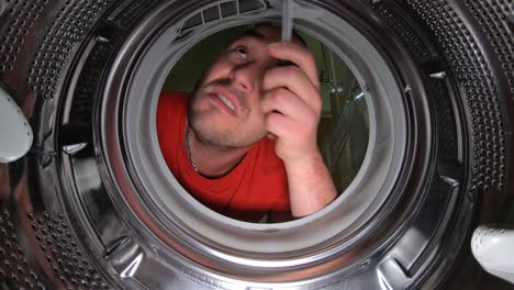 layman trying to fix a washing machine pov shot