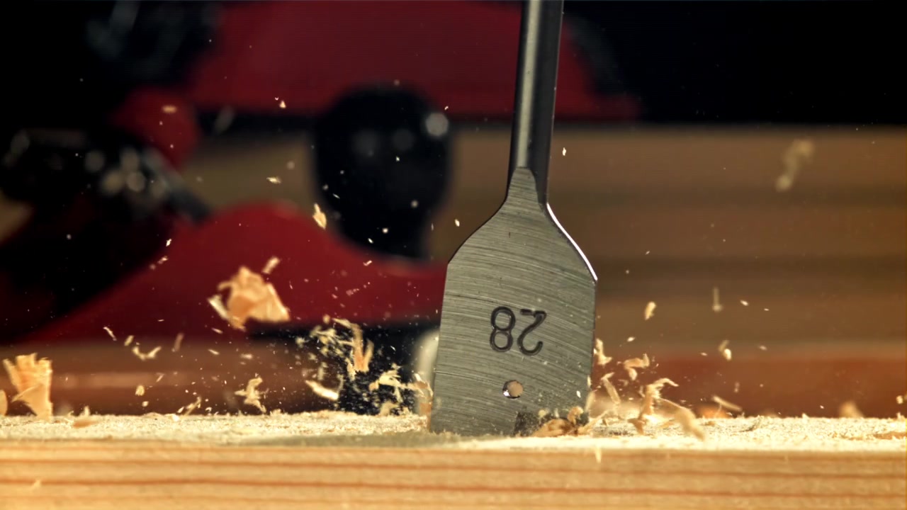 Slow Motion Close-Up of Drill Bit Drilling into Wood
