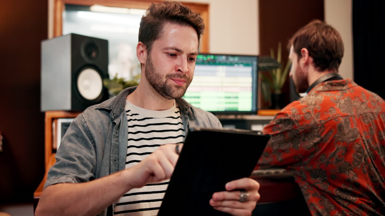 People working in a recording studio