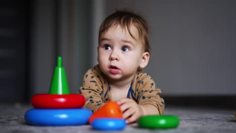 baby playing with stacking rings
