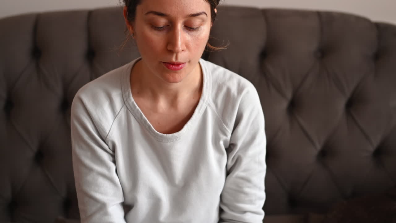 Sick woman in white clothes taking pills