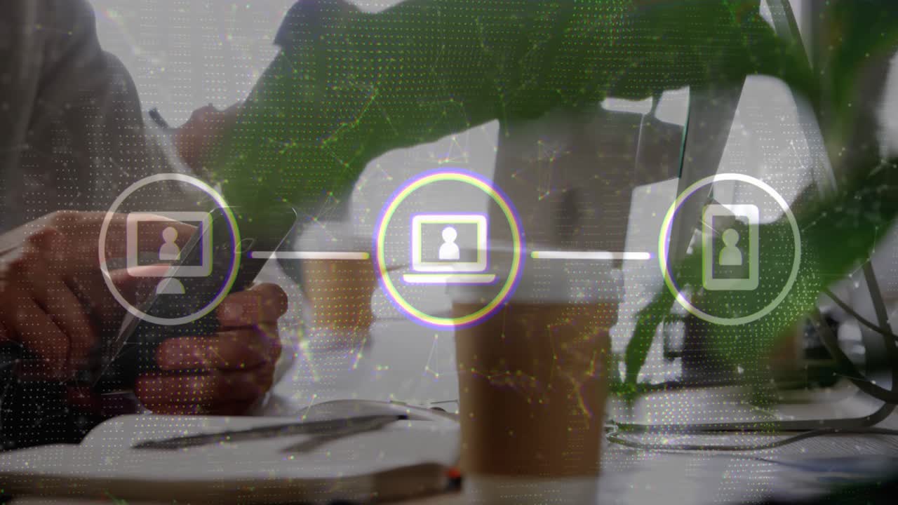 Man tapping smartphone, coworker reaching toward phone while pulsing device icons syncing tech data
