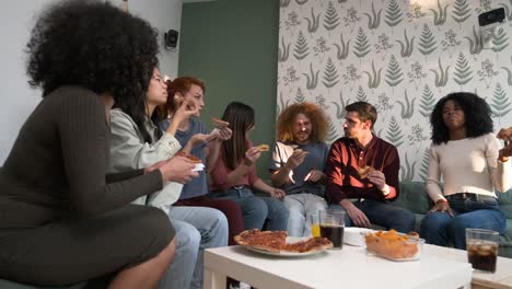 diverse friends cheering up for woman bringing pizzas during weekend party at home