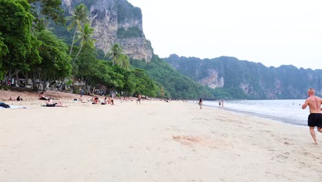 people enjoying a serene beach in krabi