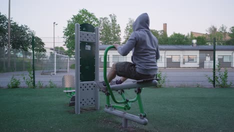 Man-using-a-rowing-machine