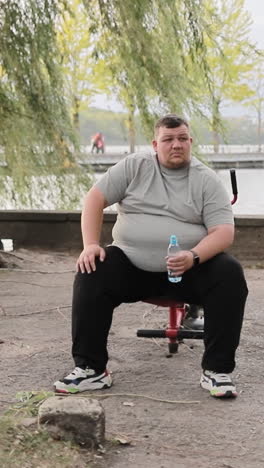 one overweight man in the park exercising male large caucasian man working outdoors weight loss one overweight man in the park exercising male large caucasian man working outdoors the concept of motivational discipline weight loss