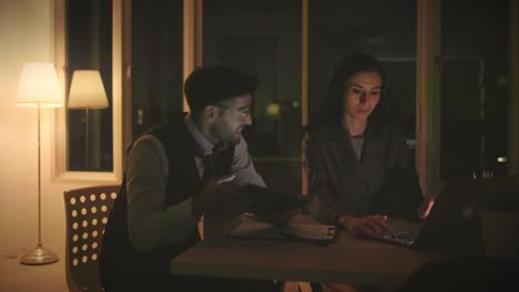 a group of caucasian businessmen receive good news on their tablets