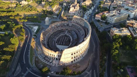 peaceful sunrise of historic colosseum - highlighting ancient roman architecture