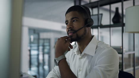 a-confident-young-man-using-a-headset