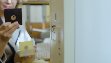 close-up view of unrecognizable businesswoman sitting at desk.