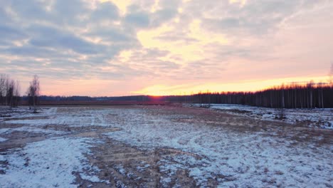 Winter-terrain-snow-covered-blue-hour-at-Daugavgriva-shores-Latvia-aerial