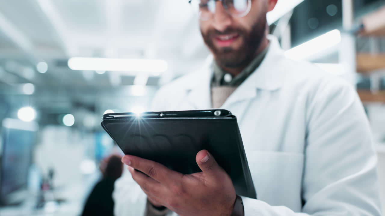 Scientist using a tablet in a lab