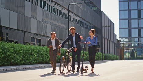 happy team walking downtown street together. smiling corporate people commute