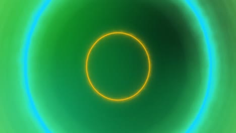 animation of yellow, blue and green pulsating neon circles on green background