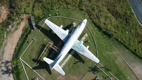 Drone-going-up-with-camera-pointed-down-on-top-of-a-big-old-plane,-open-air-museum-of-aviation,-cinema,-magic,-in-4K-resolution-Vickers-Viscount-Rolls-Royce