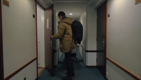 Man leaving hotel room