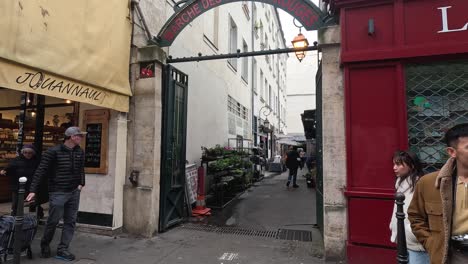 people walking and shopping at paris market