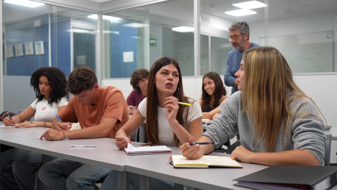 Young Students Engaged in a Classroom Discussion with their Teacher