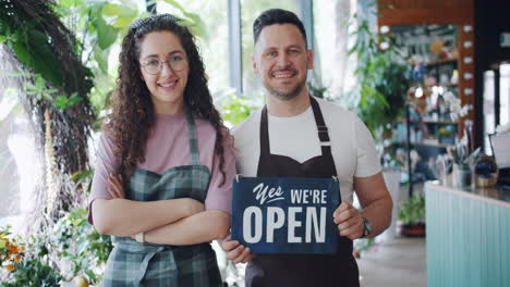 friendly florist shop owners welcoming customers