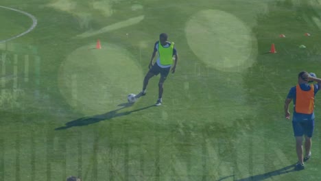 Animation-of-statistical-data-processing-over-male-soccer-player-practicing-soccer-on-sports-field