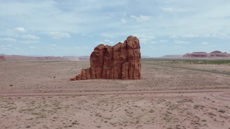 rock formation standing alone in arid, desolate desert of arizona, aerial