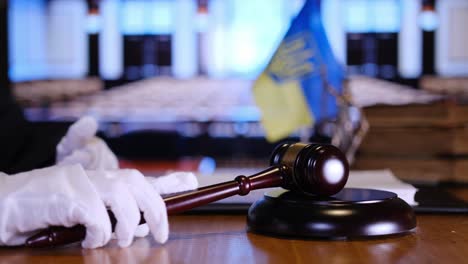 judge confidently asserting authority in courtroom with strong gestures, gavel, and american flag. vertical video