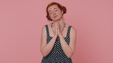 woman praying, looking upward making wish, asking with hopeful imploring expression, begging apology