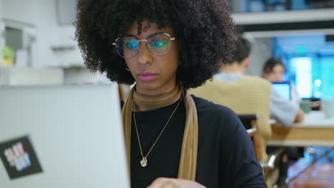 young african-american businesswoman working on laptop in the office