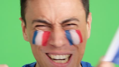 close up of a man supporting french team