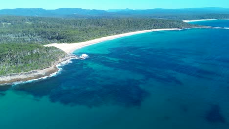 drone aerial landscape of bawley point north beach ocean sea coastline headland with bushland forest south coast australia outdoors environment reef tourism travel