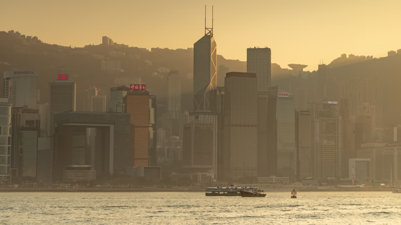 HONG KONG - 19 MARCH 2025 : Hong Kong Central city skyline filmed from across the harbour in kowloon