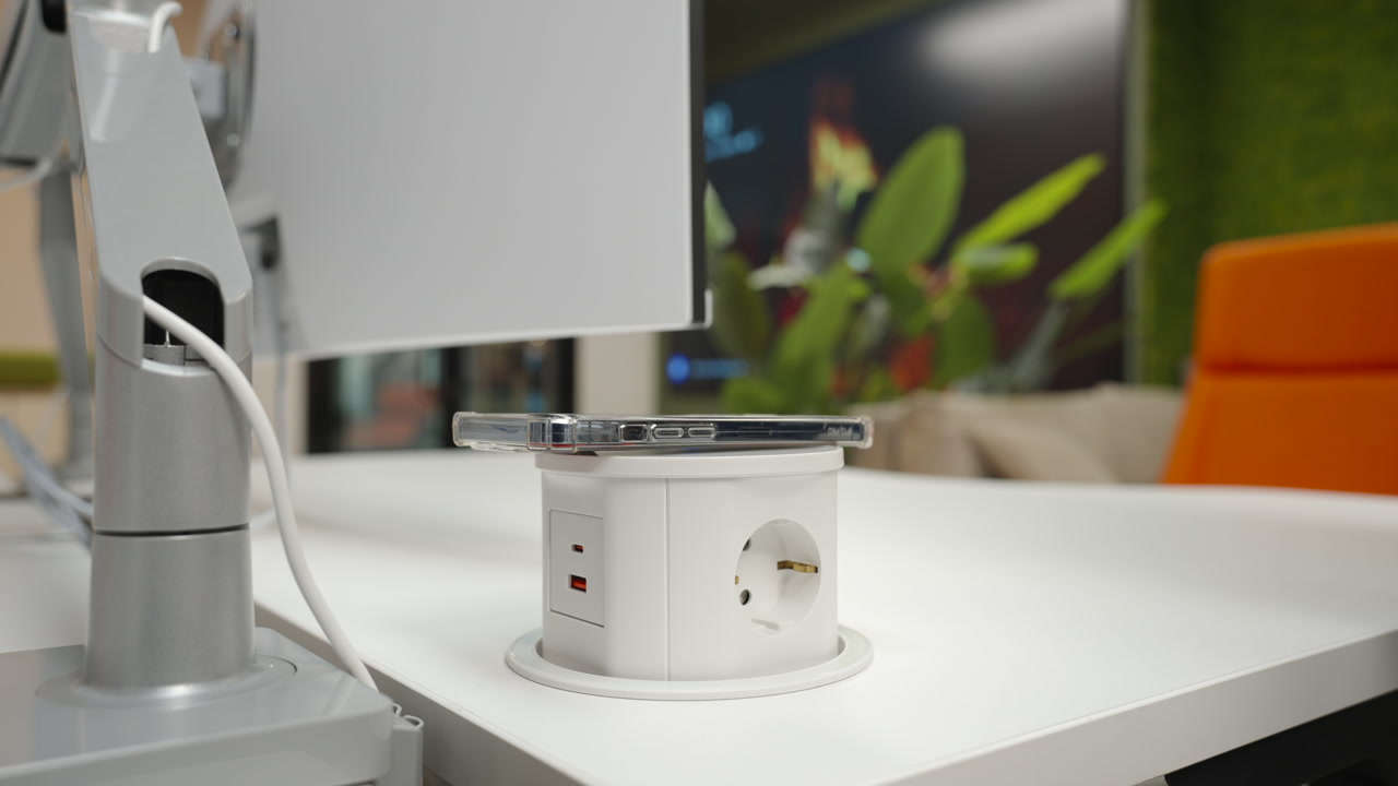 White Desk Recessed Power Hub Charging Undermonitor Cable Management With Plant And Orange Chair In Background. Creative