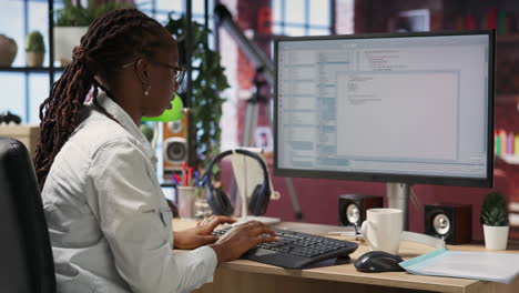 close up of person using coding application to write and test code