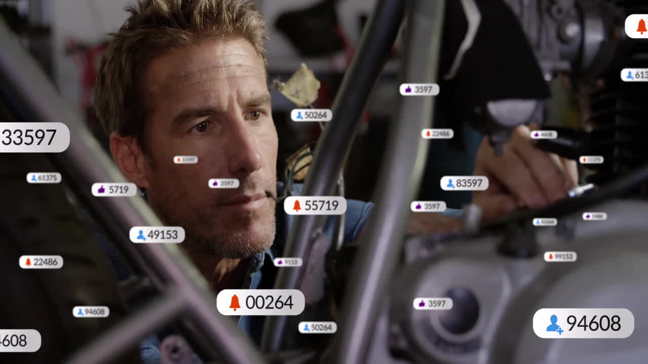 male mechanic inspecting motorcycle engine in workshop, showing floating social media UI icons