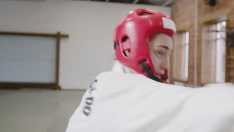 two athletes fighting indoors