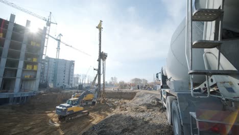 equipment for installing piles in ground, heavy machines for driving pillars work in laying the foundation building. construction aerial view height. construction site drilling pile foundation.